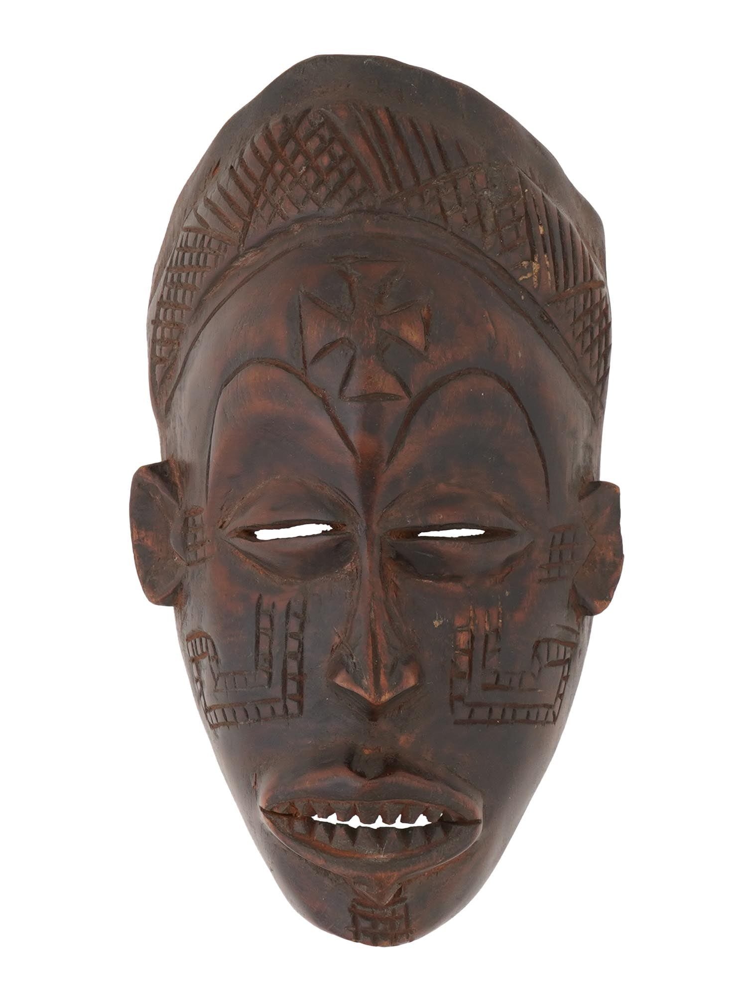SMALL CENTRAL AFRICAN CHOKWE PEOPLE CARVED MASK: A small Central African hand carved wooden mask of the Chokwe people from Congo and Angola. The mask depicts an elongated face with narrow eyes and an open mouth with sharp teeth. It is decorated with