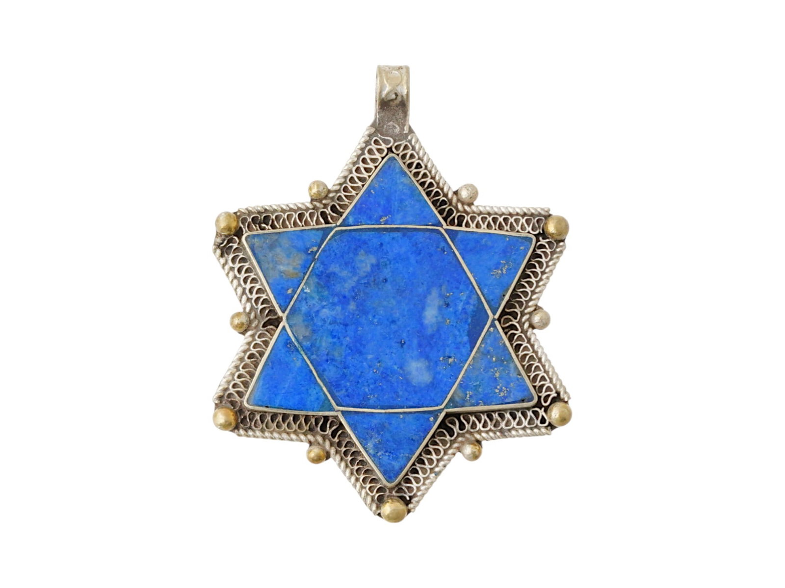 JUDAICA HOLY LAND LAPIS LAZULI SILVER STAR OF DAVID: An antique Judaica Holy Land Star of David set with carved lapis lazuli stone into a silver setting. Circa 19th century. The Magen David is decorated with an applied dotted and filigree pattern along 