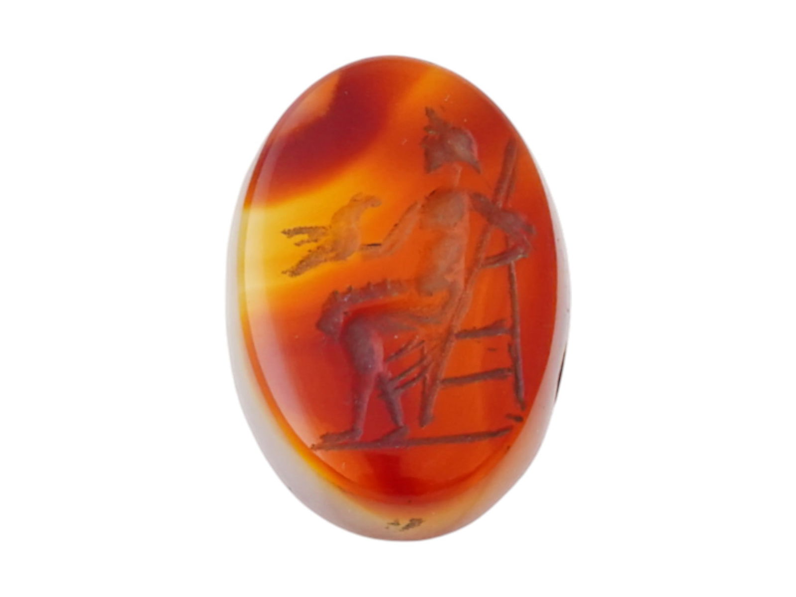 ANCIENT ROMAN CARVED OVAL SHAPED CARNELIAN INTAGLIO: An ancient Roman carved oval-shaped carnelian intaglio, dating to around 100 AD, depicting a seated male figure holding a bird. Ancient Roman Artifacts And Jewelry Collectibles. THIS LOT IS ELI