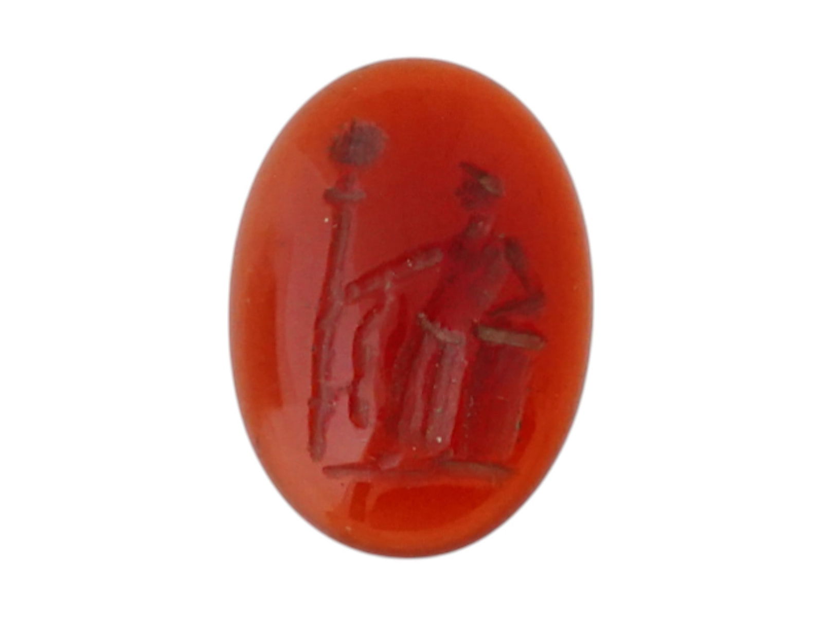 ANCIENT ROMAN CARVED OVAL SHAPED CARNELIAN INTAGLIO: An ancient Roman carved oval-shaped carnelian intaglio, dating to around 100 AD, depicting a standing male figure leaning on an altar while holding a staff. Ancient Roman Artifacts And Jewelry Collect