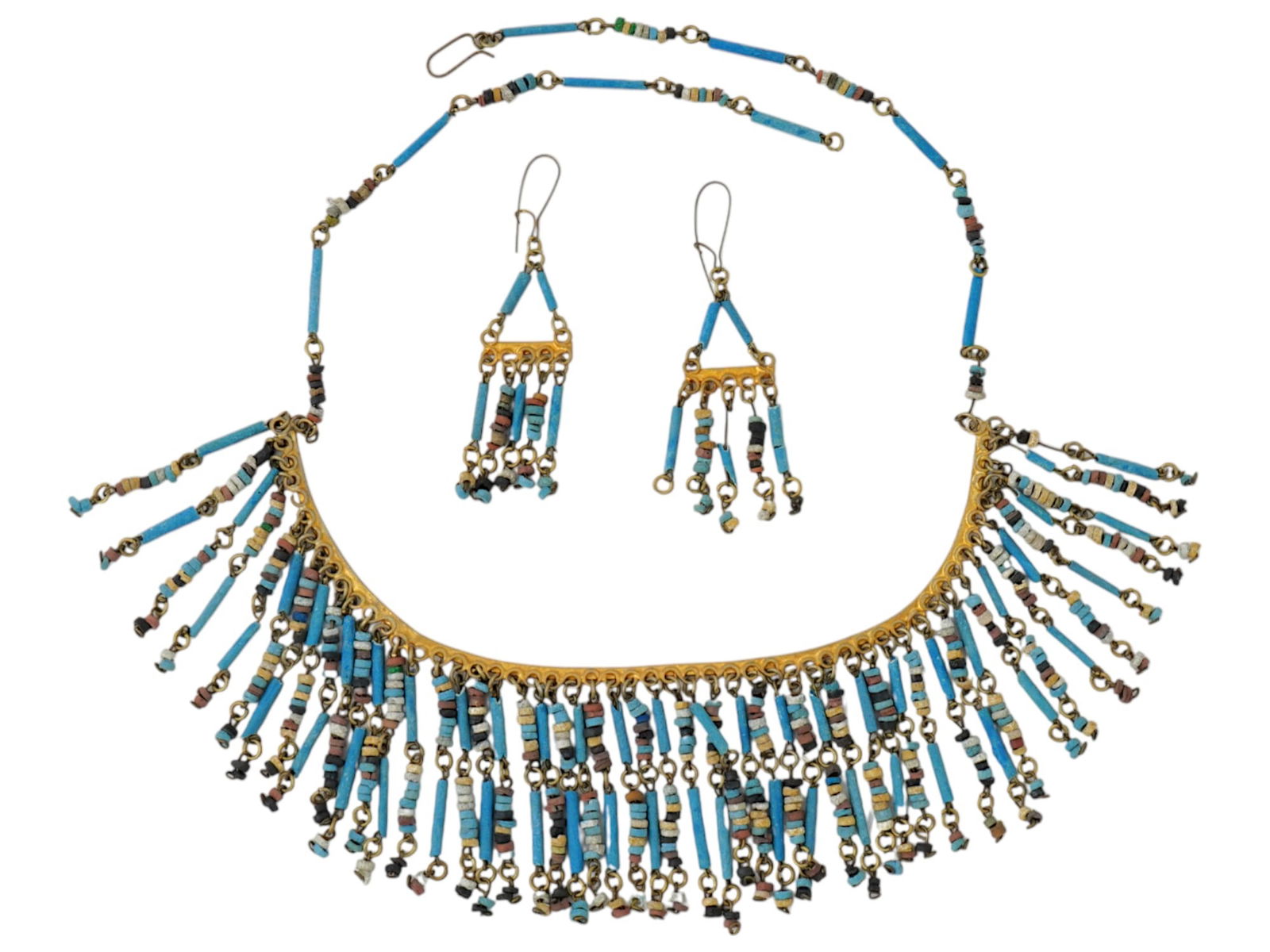 SET OF NECKLACE EARRINGS W ANCIENT TURQUOISE BEADS: A set of modern jewelry wares made in a beaded design. The set includes a necklace and a pair of earrings. The wares are made in a multilayered beaded design featuring carved Turquoise and multicolore