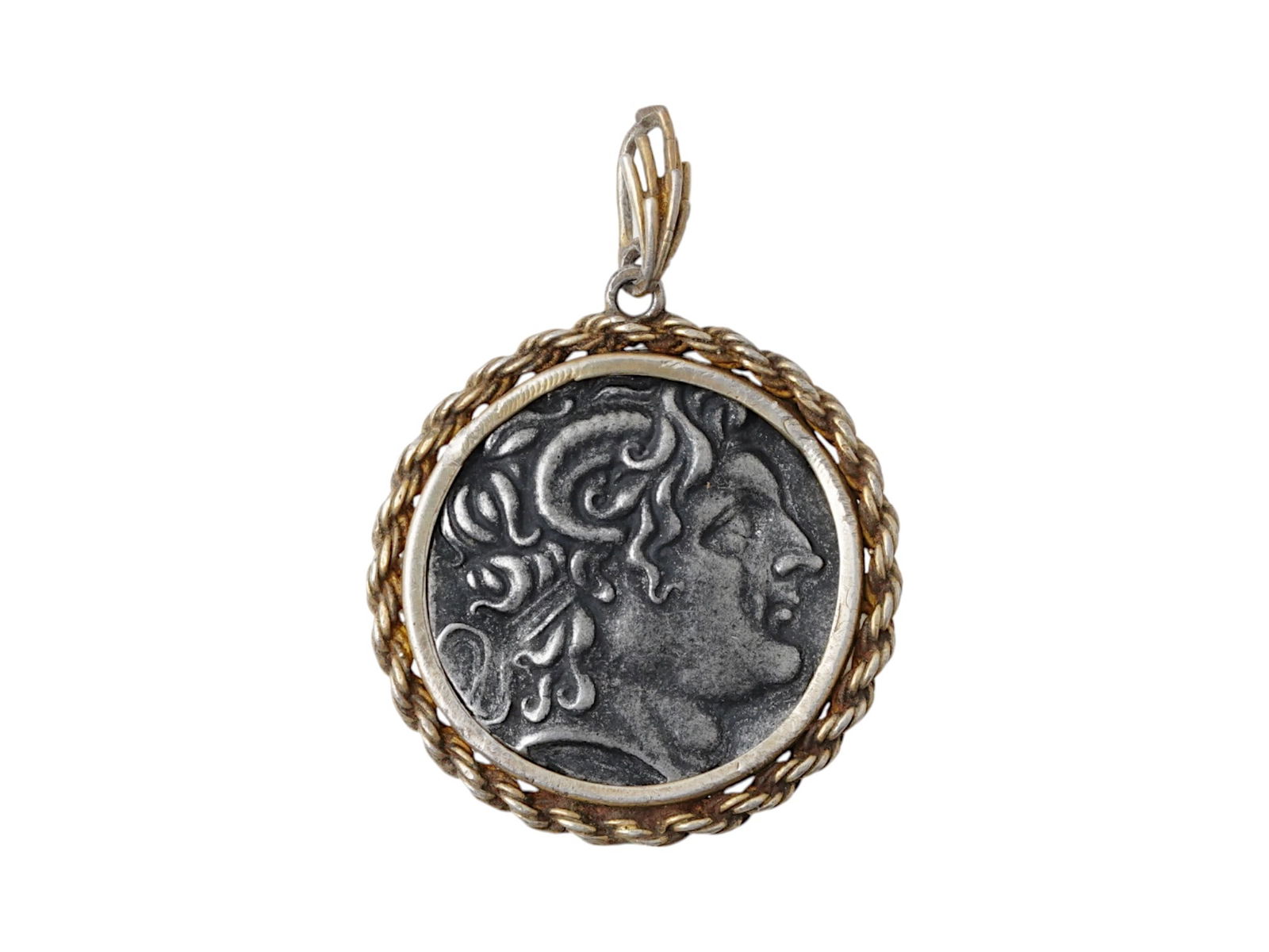 ANCIENT GREEK LYSIMACHUS TETRADRACHM SILVER COIN: An ancient Greek tetradrachm Silver coin of Lysimachus in a modern setting, gold wash over silver pendant. Circa 291 to 281 B.C. Obverse: Diademed head of Alexander the Great right, wearing horn of Am