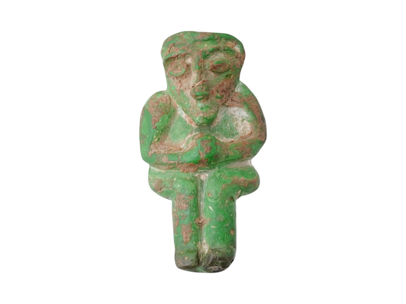 ANCIENT PERSIAN FAIENCE PENDANT OF A CROUCHING FIGURE: An ancient Persian faience pendant depicting a crouching figure, dating to circa 500 BC. This small amuletic object reflects the characteristic stylization of Achaemenid-period craftsmanship, likely i
