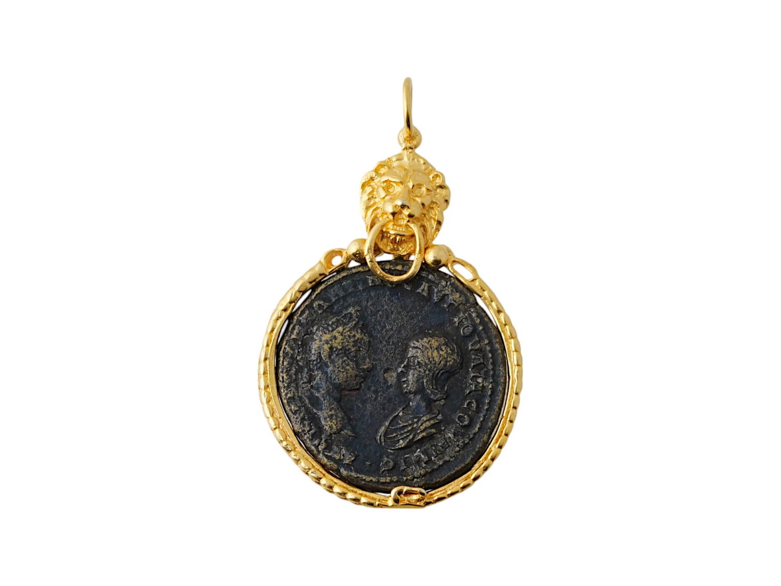 ANCIENT ROMAN BRONZE COIN GOLD WASH OVER SILVER SETTING: An ancient Roman bronze coin presented in a modern setting. The bronze coin, struck circa 200 AD, is now reborn in a modern context. The coin, once circulating within the vast Roman world, has been ca