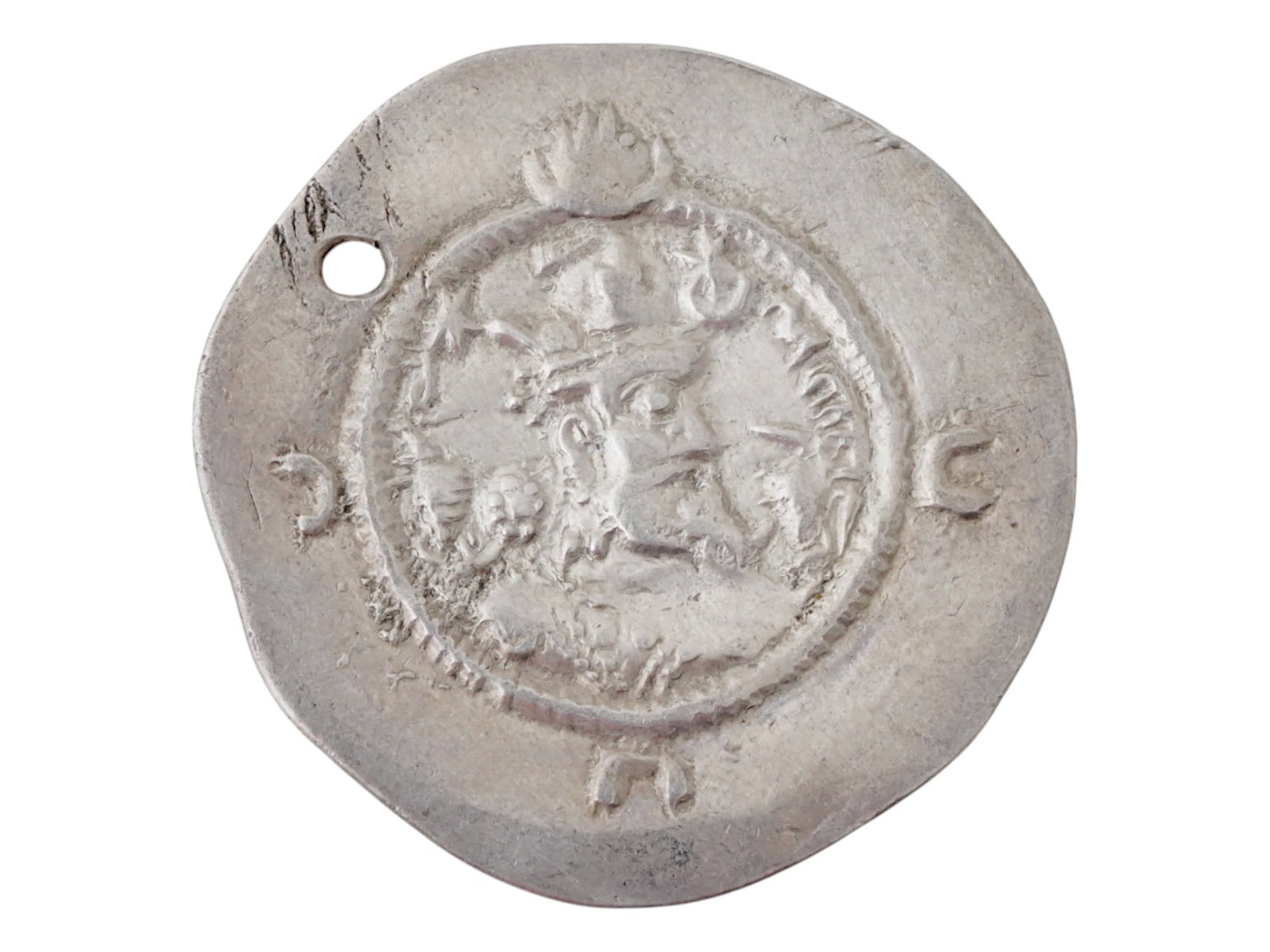 ANCIENT SASANIAN EMPIRE KAWAD II DRACHM SILVER COIN: An ancient Sasanian Empire Kawad II Drachm silver coin. The obverse shows the bust of Kavad II right, wearing mural crown with frontal crescent and korymbos set on crescent, ribbon on left shoulder, c