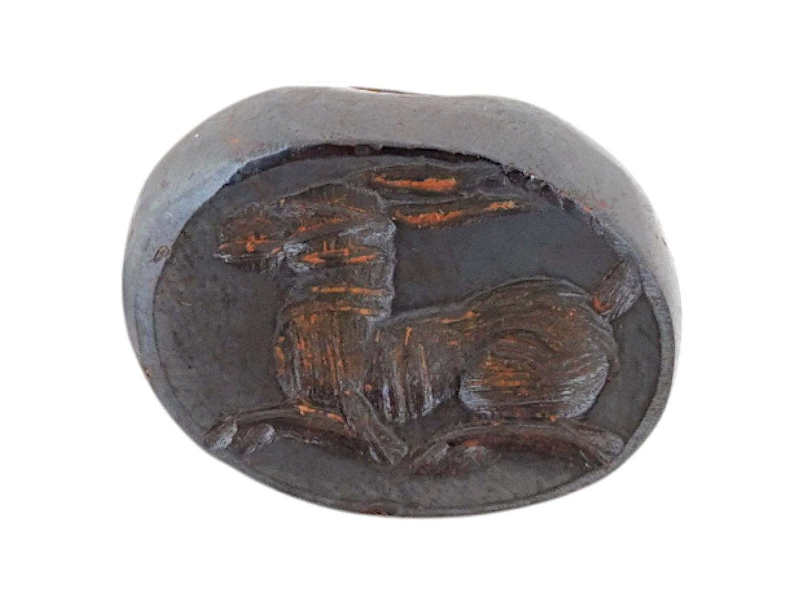 ANCIENT PERSIAN SASSANIAN HEMATITE STAMP SEAL 600 AD: An ancient Persian Sassanian carved hematite stamp seal of rounded shape with a drilled hole. Adorned with an engraved image of an animal, presumably an anthelope. Circa 600 AD. Museum Pieces, Ancient