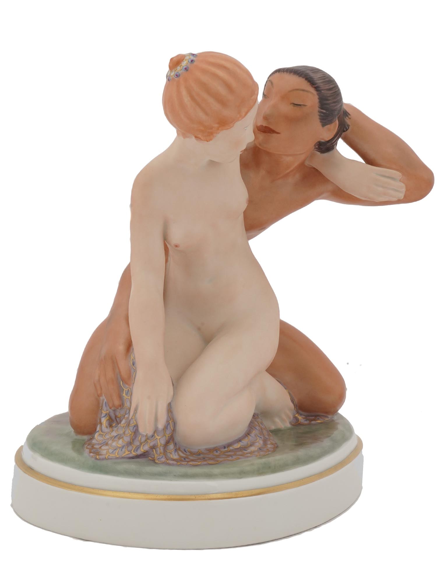 ROYAL COPENHAGEN G. HENNING FIGURINE CUPID PSYCHE: A fine Danish glazed polychrome figural group No 1796, modeled by Gerhard Henning, 1880 to1967, for Royal Copenhagen. The figural group depicts a scene with Cupid hugging Psyche. Mounted on a round sh