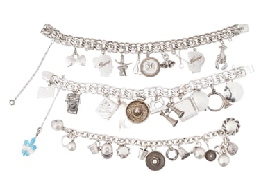THREE VINTAGE SILVER JEWELRY CHARM BRACELETS