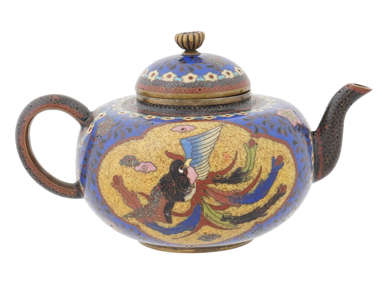 ANTIQUE JAPANESE MEIJI CLOISONNE ENAMEL LIDDED TEAPOT: An antique Japanese Meiji era cloisonne enamel lidded teapot. The enamel body is decorated with two opposing panels depicting a dragon and a phoenix bird, framed by beaded motifs. The lid features a b