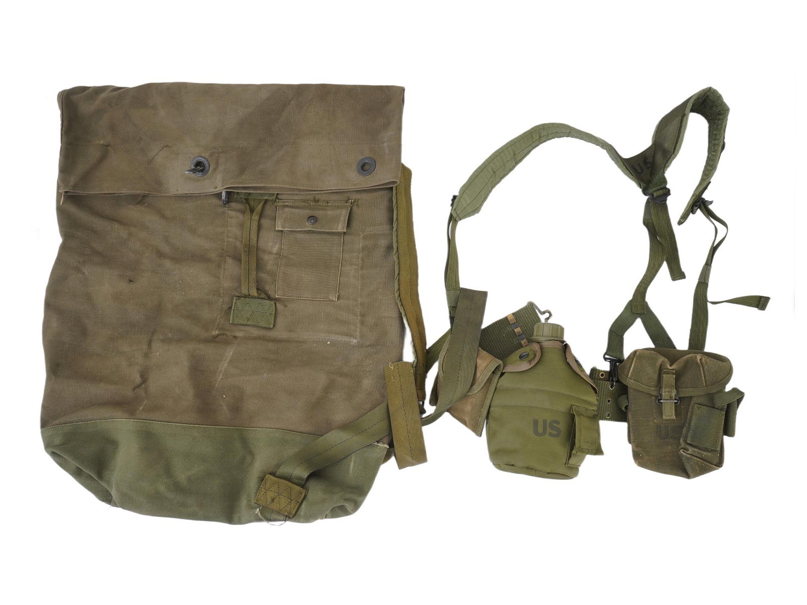 VINTAGE U.S. BAZOOKA ROCKET BAG LOAD CARRYING EQUIPMENT: A vintage U.S. military belt and bag set, consisting of items from both the World War II and Vietnam War eras. The large canvas bag is identified as a U.S. M6 bazooka rocket bag. It is made of heavy c