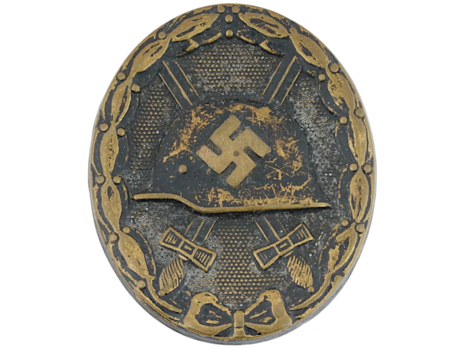 WWII ERA GERMAN NAZI MILITARY INJURY AWARD BADGE: A WWII era German Nazi third class injury award badge from 1939. It depicts two crossed swords and a helmet with a swastika. Second World War Historical Collectables And Memorabilia, Military Insignia
