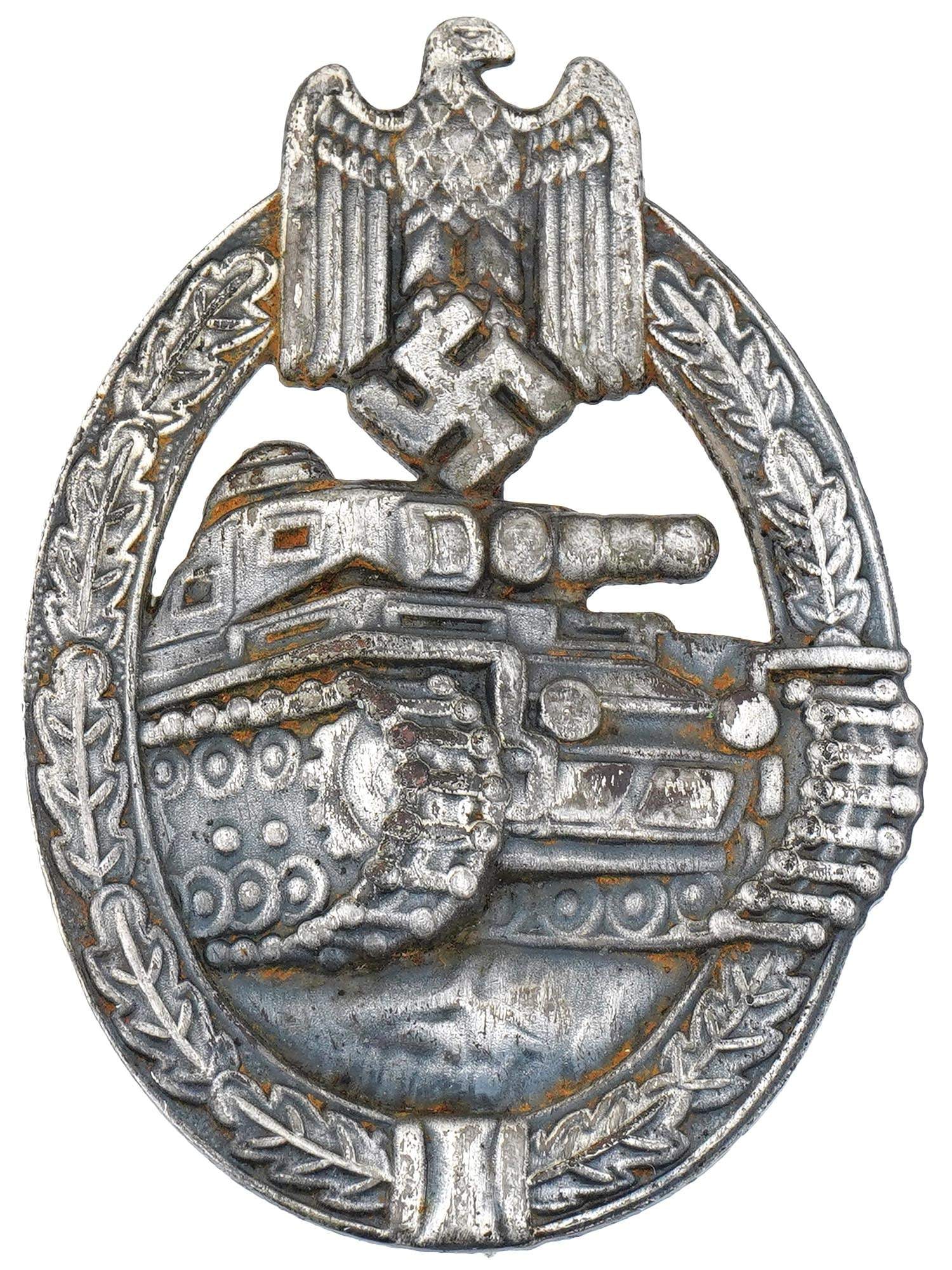 WORLD WAR II NAZI GERMAN THIRD REICH PANZER BADGE: A WWII Nazi German Panzer badge, oval in shape, featuring a three-quarters front image of a Panzer IV tank, surrounded by an oak wreath and surmounted by the Wehrmacht eagle clutching a swastika. Seco