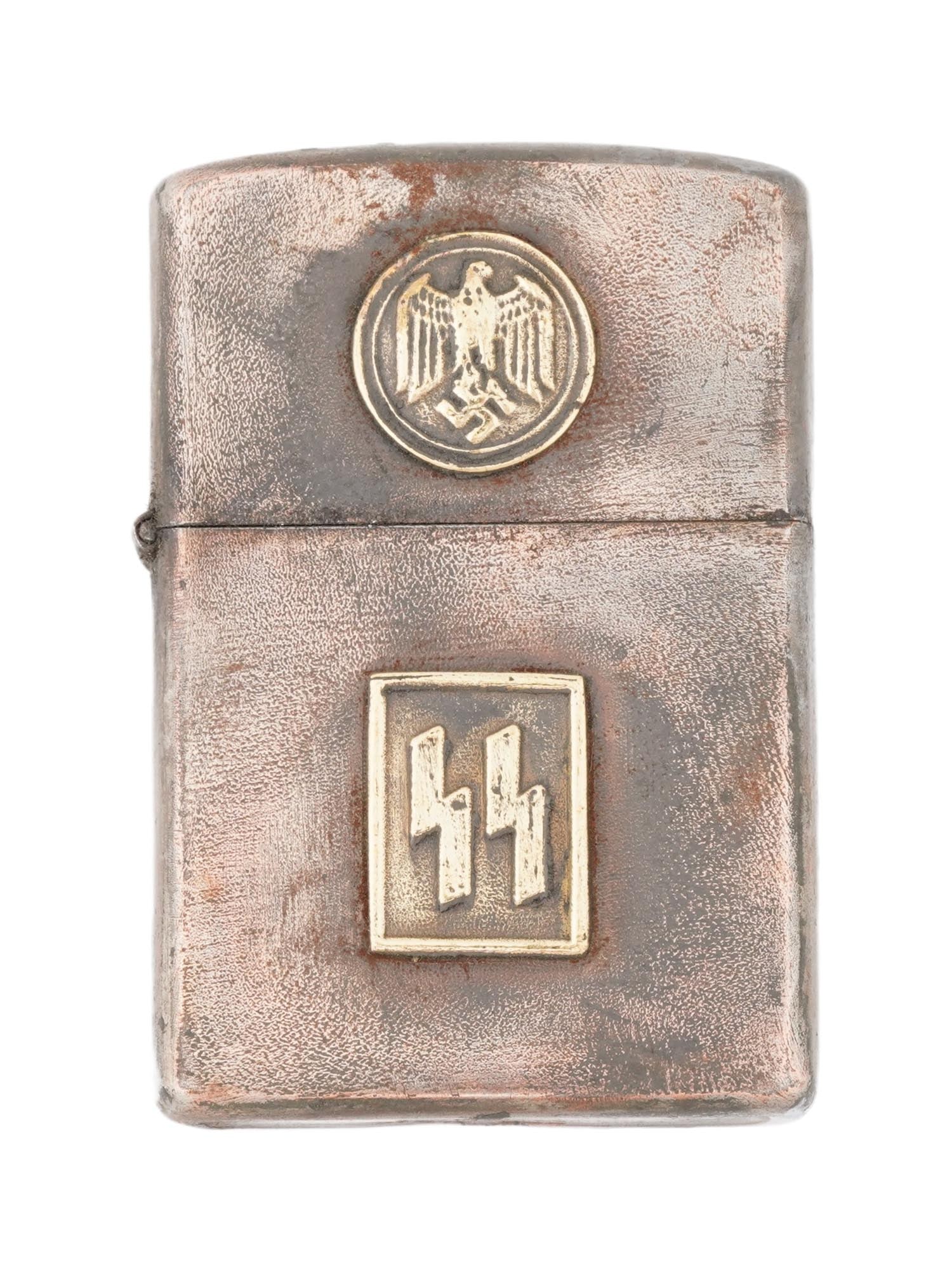 NAZI GERMAN WWII TYPE WAFFEN SS CIGARETTE LIGHTER: A WWII type German Third Reich Waffen SS Zippo manner metal gas lighter. Features a German eagle clutching a swastika insignia on the lid and SS emblem on the case. Hallmarked on the bottom. World War