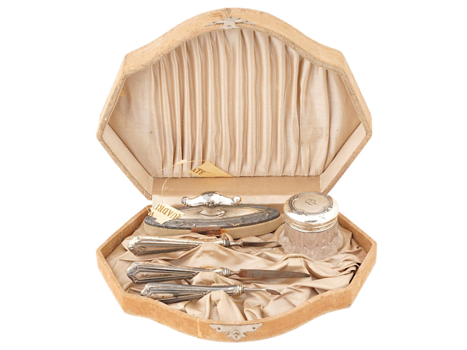 WWII TYPE EVA BRAUN MONOGRAMMED MANICURE SET IOB: A WWII Nazi German type monogrammed manicure set. The set includes various manicure tools, including a nail file and a cream jar with a lid. Each item is garnished with engraved initials EB referring