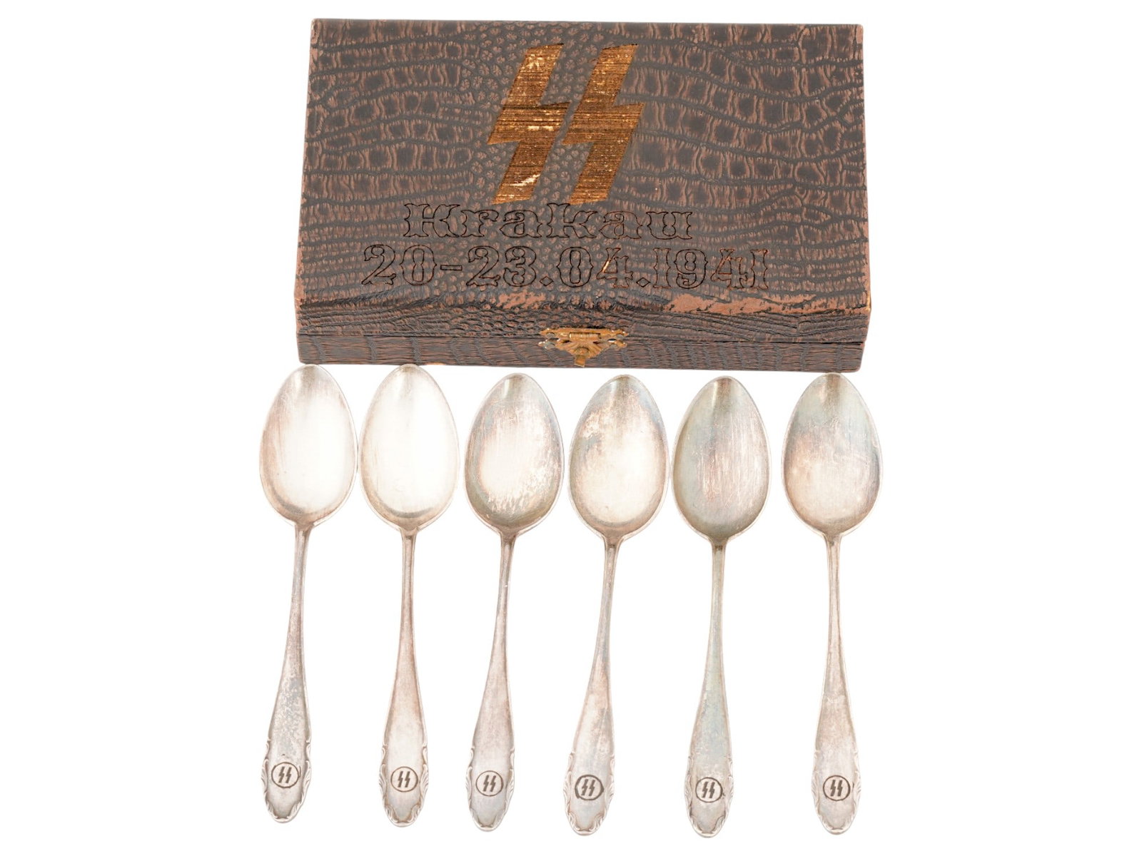 SET WWII TYPE TEA SPOONS FROM SS OFFICERS CANTEEN IOB: A set of six WWII type Nazi German tea spoons from a Waffen SS officers canteen, featuring a foliage motif and SS rune insignias on both sides of the handles, hallmarked and presented in the original 
