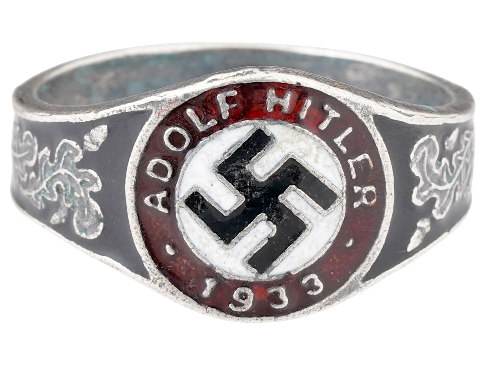 GERMAN WWII TYPE ELECTION ADOLF HITLER SILVER RING: A WWII type Nazi German Third Reich Adolf Hitler 1933 elections Silver ring. The exterior of the ring is engraved with oak leaves and covered with black, red and white enamel with a swastika insignia 