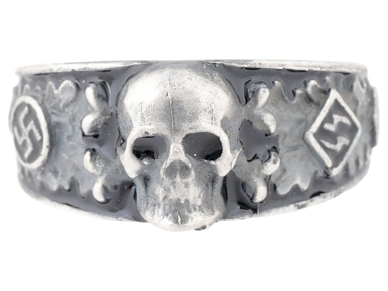 WWII TYPE GERMAN SS SECRET SOCIETY AHNENERBE SILVER RING: A WWII type German SS secret society Ahnenerbe silver ring. The ring is adorned with engraved and black enameled oak leaves, SS swastika insignias to the sides, and an engraved image of a skull Totenk
