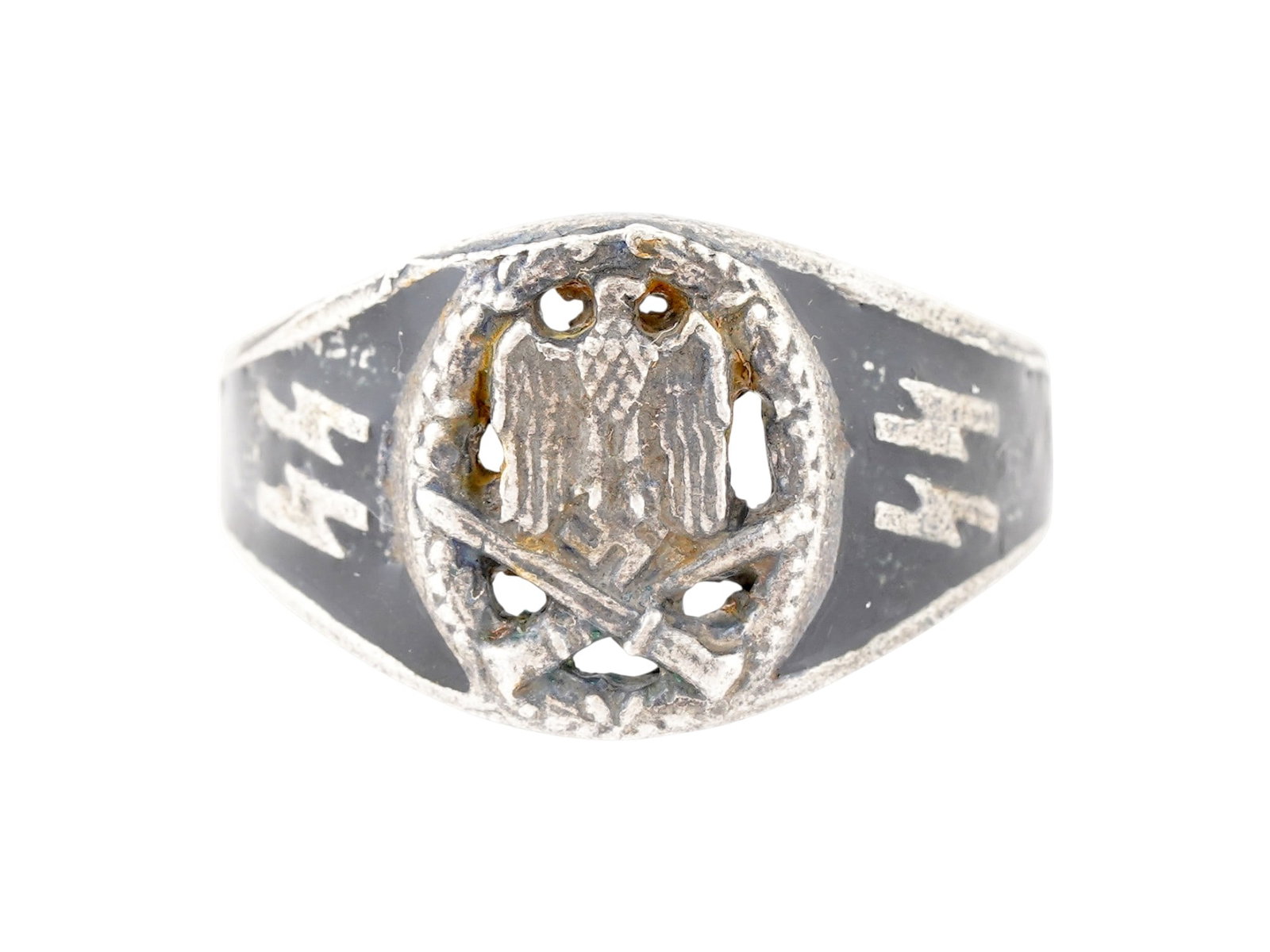 WWII MODEL GERMAN WAFFEN SS GENERAL ASSAULT SILVER RING: A WWII model Nazi German type Waffen SS General Assault Silver ring. The ring is adorned with an engraved image of a Nazi eagle holding a swastika insignia and crossed swords below, SS runes, on the s