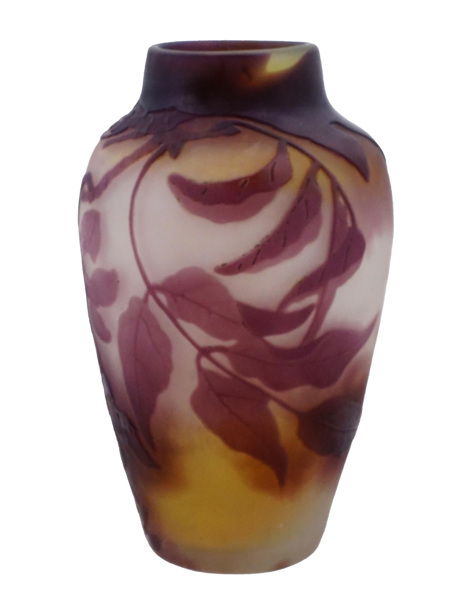 ANTIQUE ART NOUVEAU CAMEO GLASS VASE BY EMILE GALLE: An antique Art Nouveau cameo glass vase by Emile Galle. The red and yellow vase is decorated with flowers and leaves. Marked Galle in a cameo on the backside. Emile Galle, from 1846 to 1904, was a Fre