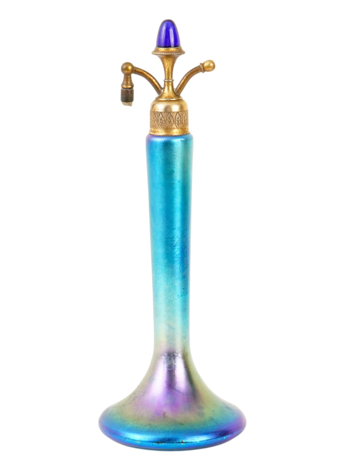 VINTAGE STEUBEN BLUE AURENE ART GLASS PERFUME ATOMIZER: A vintage Steuben Blue Aurene art glass perfume atomizer, dating to the 1920s or 1930s, executed in iridescent blue glass with gilt metal mounts, typically associated with DeVilbiss hardware of the pe