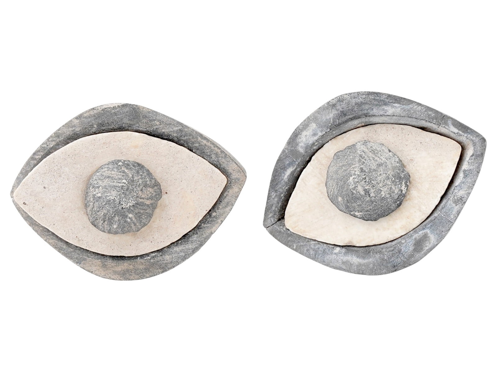 PAIR OF ANCIENT CARVED STEATITE EYES OF SEPARATE PARTS: A pair of ancient carved steatite eyes, dating from 3000 to 2000 BC. Each piece is composed of three separate parts, the iris, sclera, and eyelids, demonstrating an advanced understanding of anatomica