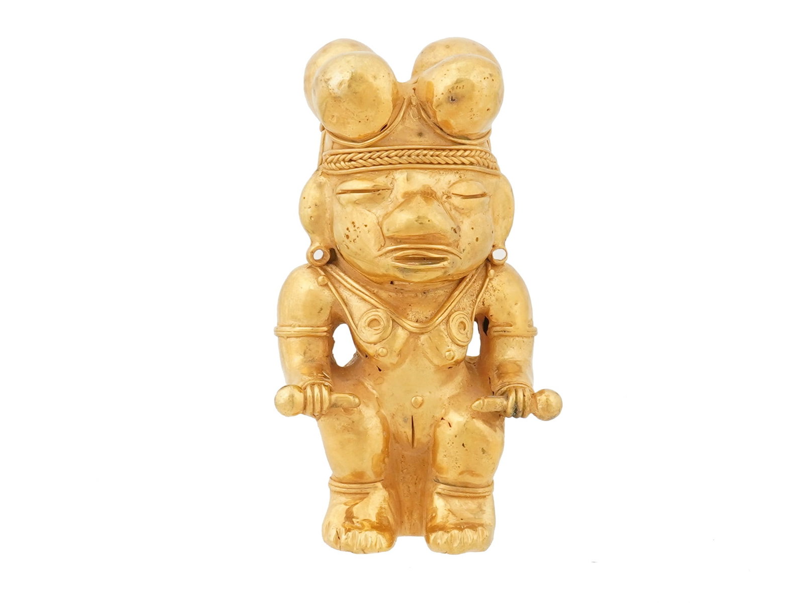PRE COLUMBIAN TAIRONA TUMBAGA STYLE SHAMAN FIGURINE: A figurine of a seated female shaman with a Poporo crown on the top. In the style of ancient Pre Columbian Tairona tumbaga art. Tumbaga, an alloy of gold and copper, showcases the metallurgical profic