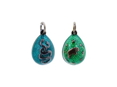 TWO RUSSIAN GILT SILVER AND ENAMEL EASTER EGG PENDANTS