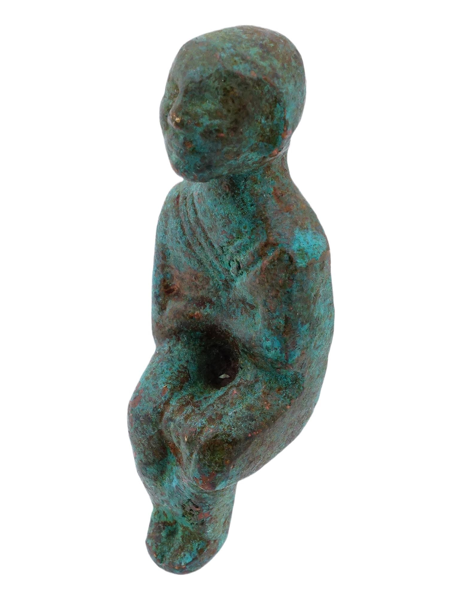 ANCIENT BYZANTINE OR ROMAN BRONZE SEATED FIGURE: An ancient Byzantine or Roman bronze seated figure, dating from the Late Roman to Early Byzantine period. Cast in solid bronze, the sculpture depicts a seated or crouching pose, a form commonly found