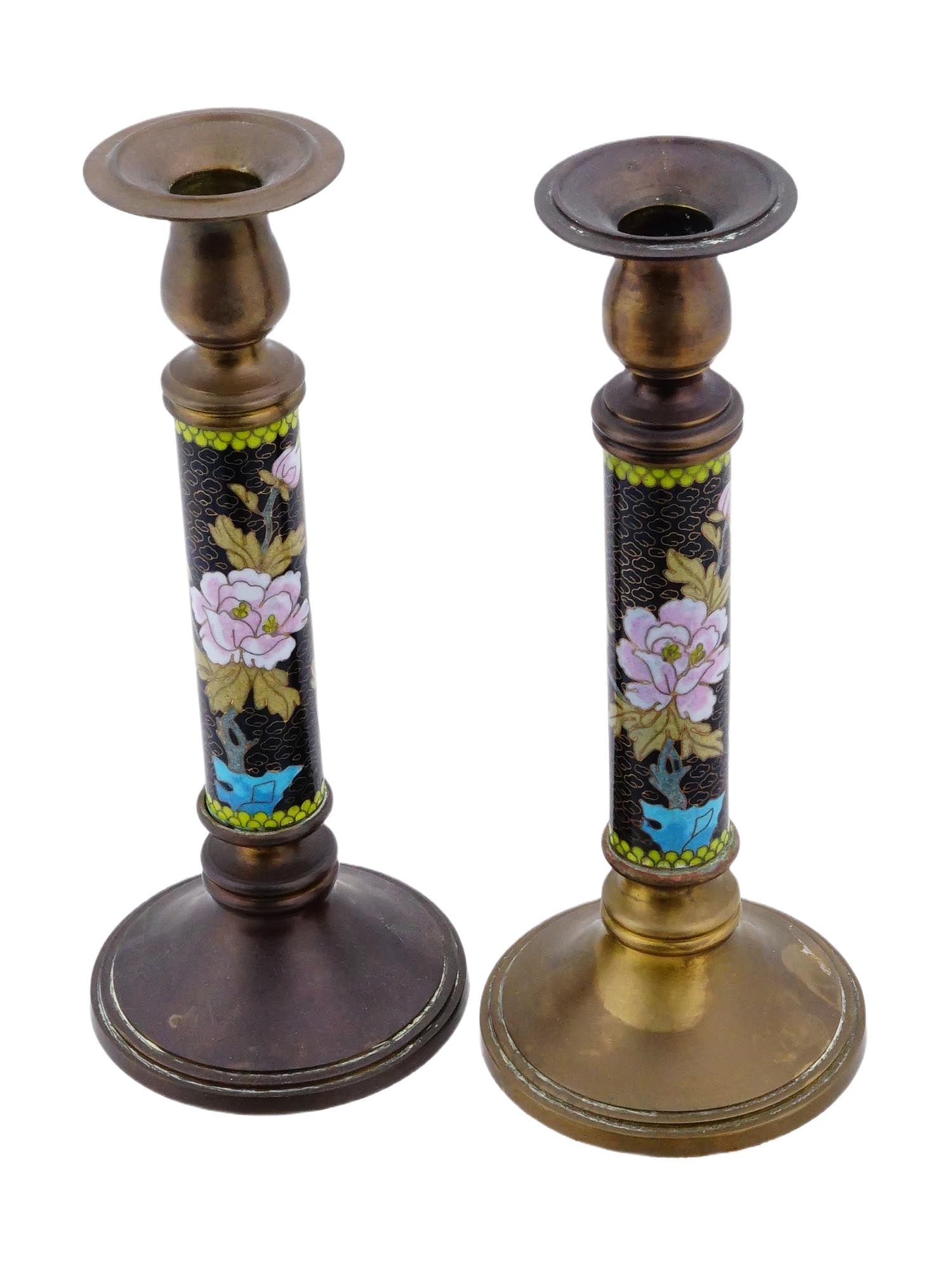 PAIR OF JAPANESE CLOISONNE ENAMEL METAL CANDLESTICKS: A pair of Japanese cloisonne enamel metal candlesticks. The candlesticks are adorned with a decorative design depicting flowers and birds, against a black ground. Antique Oriental Candleholders and Li