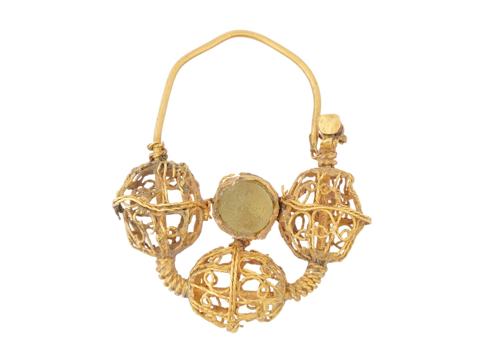 ANCIENT BYZANTINE GOLD AND GLASS PENDANT 300 TO 500 AD: An ancient Byzantine gold and glass pendant, dating from 300 to 500 AD. The pendant features a filigree construction with a looped bail at the top, suggesting it was meant to be worn suspended. The ma