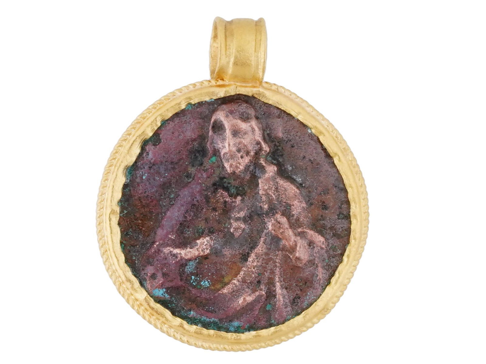 ANCIENT BYZANTINE BRONZE AND GOLD JESUS PENDANT: An ancient Byzantine bronze and gold medallion pendant, depicting the Image of Jesus Christ on one side and Virgin Mary on the other. Circa 500 AD or later. Set within a gold frame with a suspension l