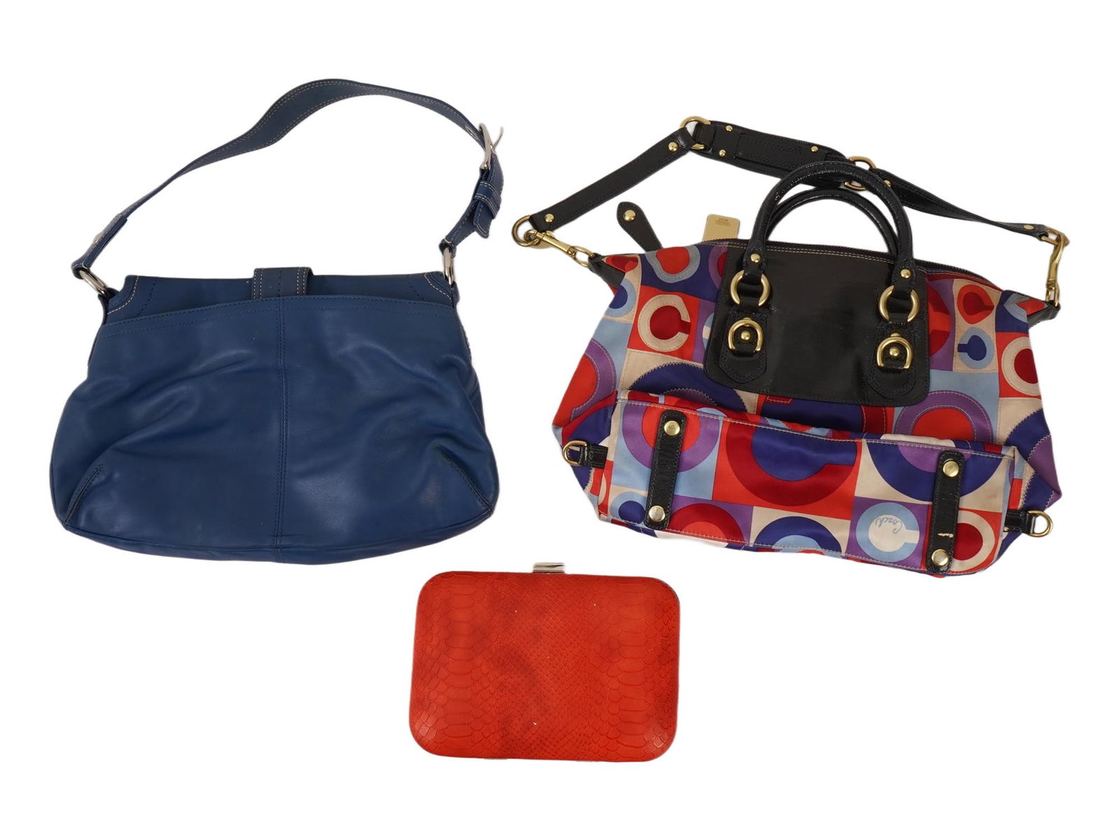 COACH SOHO OP ART SABRINA SATCHEL AND CLUTCH BAGS: A lot of three bags, including a blue leather Coach Soho hobo bag, a Coach Op Art Sabrina Satchel shoulder bag, and a miniature red clutch bag. Fashion Accessories, Bags for Women. THIS LOT IS