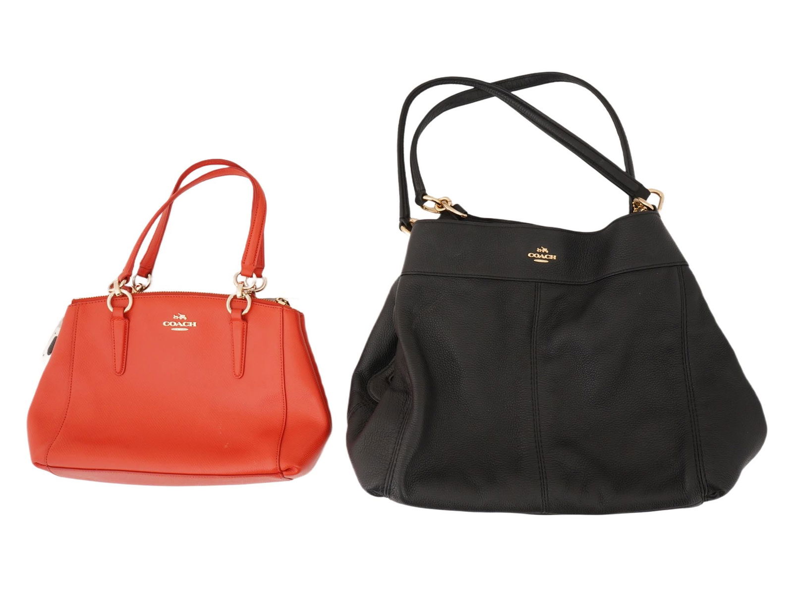 LOT OF TWO AMERICAN COACH LEATHER HANDBAGS: A lot of two American Coach leather handbags. The first bag has a vibrant coral color, with a structured, satchel-like shape with gold-tone hardware. It has two top handles and a zippered closure acro