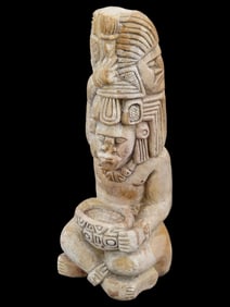 CARVED STONE SCULPTURE OF A MESOAMERICAN IDOL