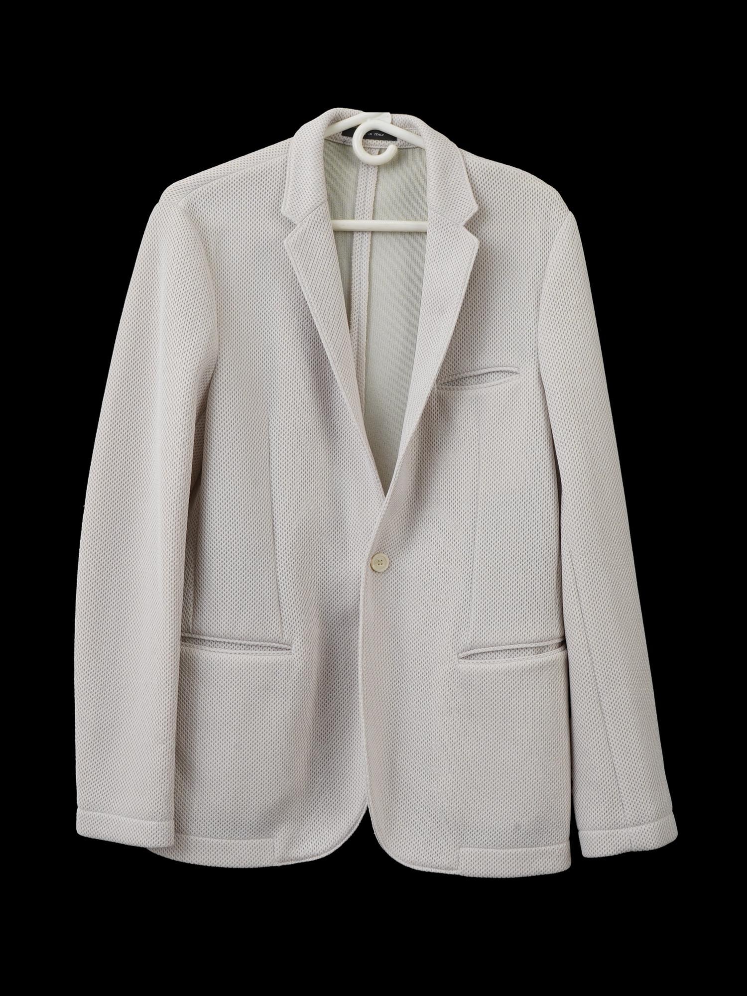 ITALIAN EMPORIO ARMANI JOHNNY LINE WHITE JACKET: An Italian Emporio Armani white jacket. It has a textured, possibly knitted, fabric, a single-button closure, notched lapels, and patch pockets on the hips, and a breast pocket. Bears brands tags insc