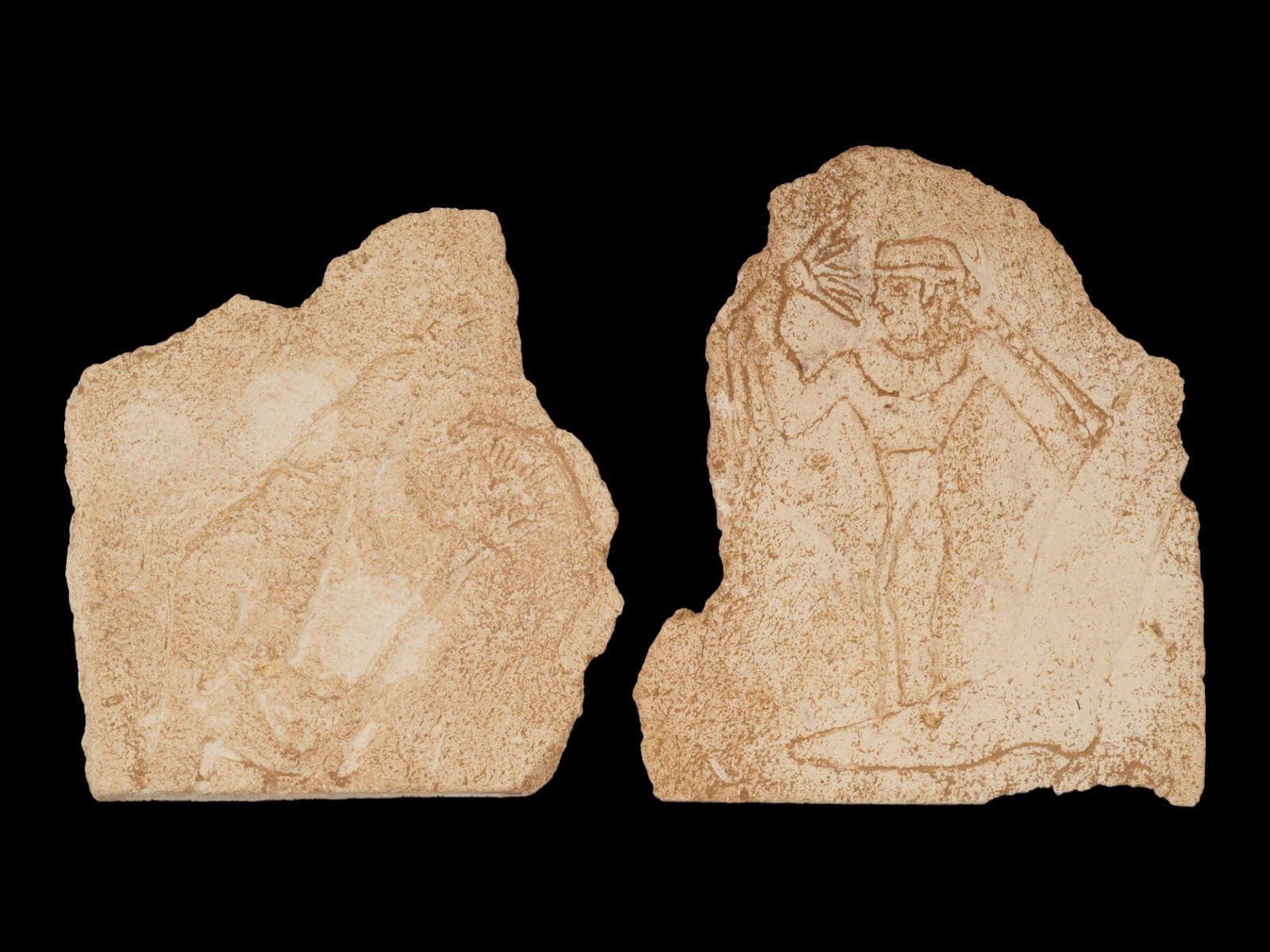 PAIR OF ANCIENT EGYPTIAN LATE PERIOD STONE FRAGMENTS: A pair of ancient Egyptian stone fragments dating to the Late Period, circa 664 to 332 BC, each engraved with incised images and motifs characteristic of temple or tomb reliefs from the era. The carvi