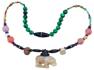 VINTAGE BEADED NECKLACE WITH A CARVED HIPPO PENDANT