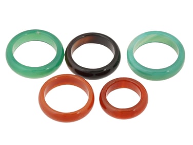 GROUP OF FIVE VINTAGE BAND STYLE JADE AND STONE RINGS