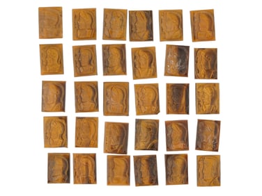 COLLECTION OF 30 HAND CARVED TIGERS EYE STONE CAMEOS