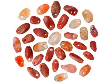COLLECTION OF ANCIENT CARVED AGATE AND CARNELIAN BEADS