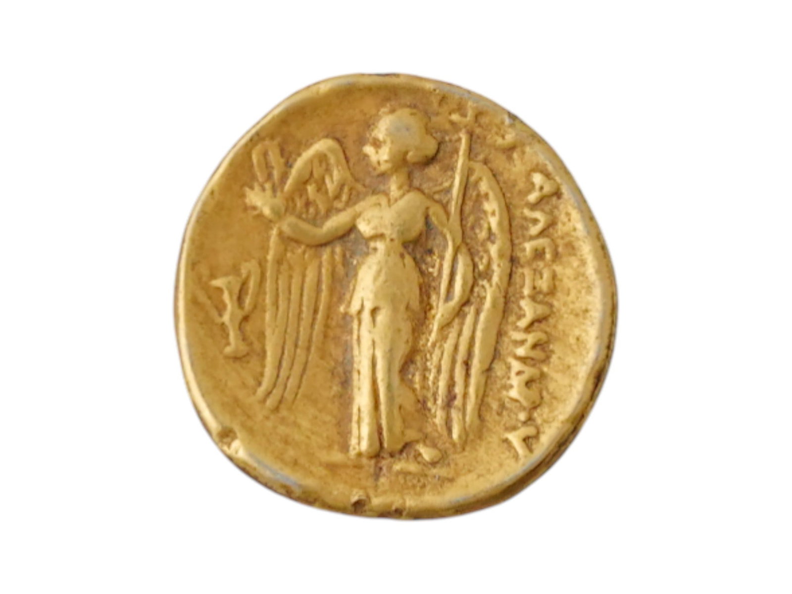 ANTIQUE GREEK ALEXANDER THE GREAT GILT STATER COIN: An antique Greek Alexander the Great gilt metal stater coin. Circa 1900 AD. The obverse depicts the helmeted head of Athena turned to the right. The reverse depicts winged Victory holding a scepter. T