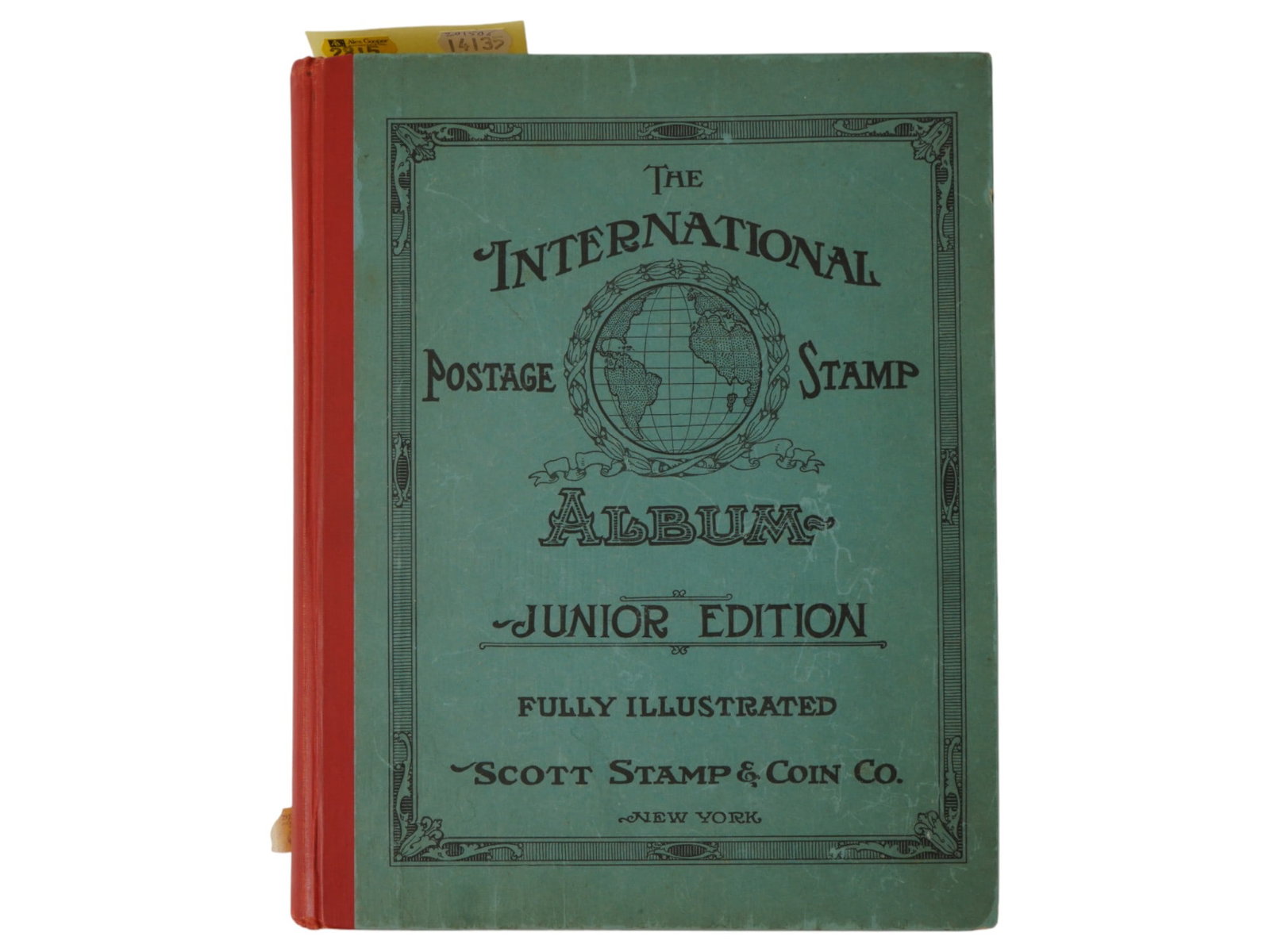 INTERNATIONAL POSTAGE STAMP ALBUM JUNIOR EDITION: A group of vintage postage stamps, collected in The International Postage Stamp Album Junior Edition issued by Scott Stamp and Coin Co., New York. This album contains international collectible postage