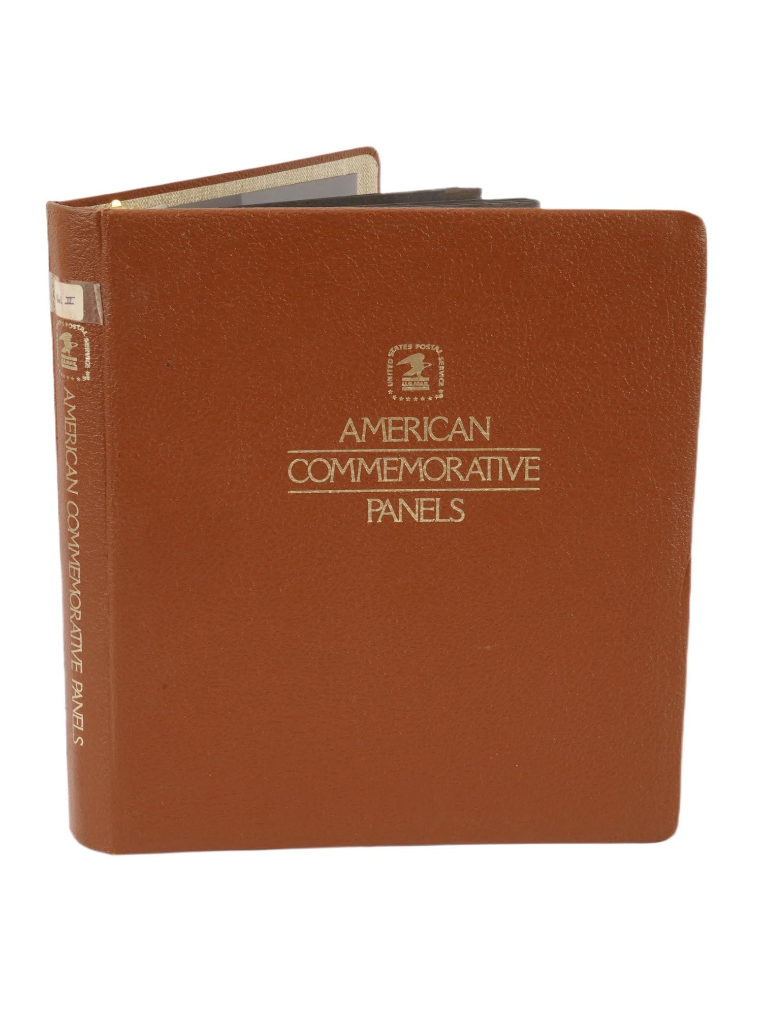 LOT OF VTG AMERICAN COMMEMORATIVE STAMPS IN ALBUM: A collection of vintage American stamps collected in an album titled American Commemorative Panels. The album contains information and commemorative stamps related to Christmas, Benjamin West, Pioneer