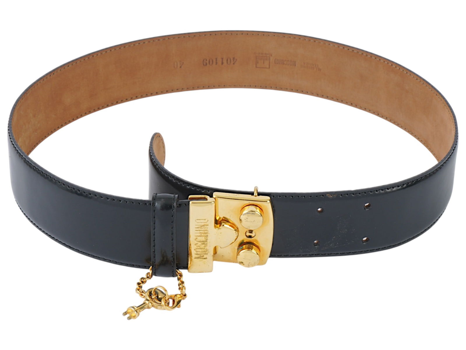 BLACK GENUINE LEATHER BELT BY MOSCHINO: A black leather belt by Moschino. The belt has a large, gold-colored metal buckle with the word MOSCHINO engraved on it. There is a gold-colored key charm hanging from a chain attached to the buckle.