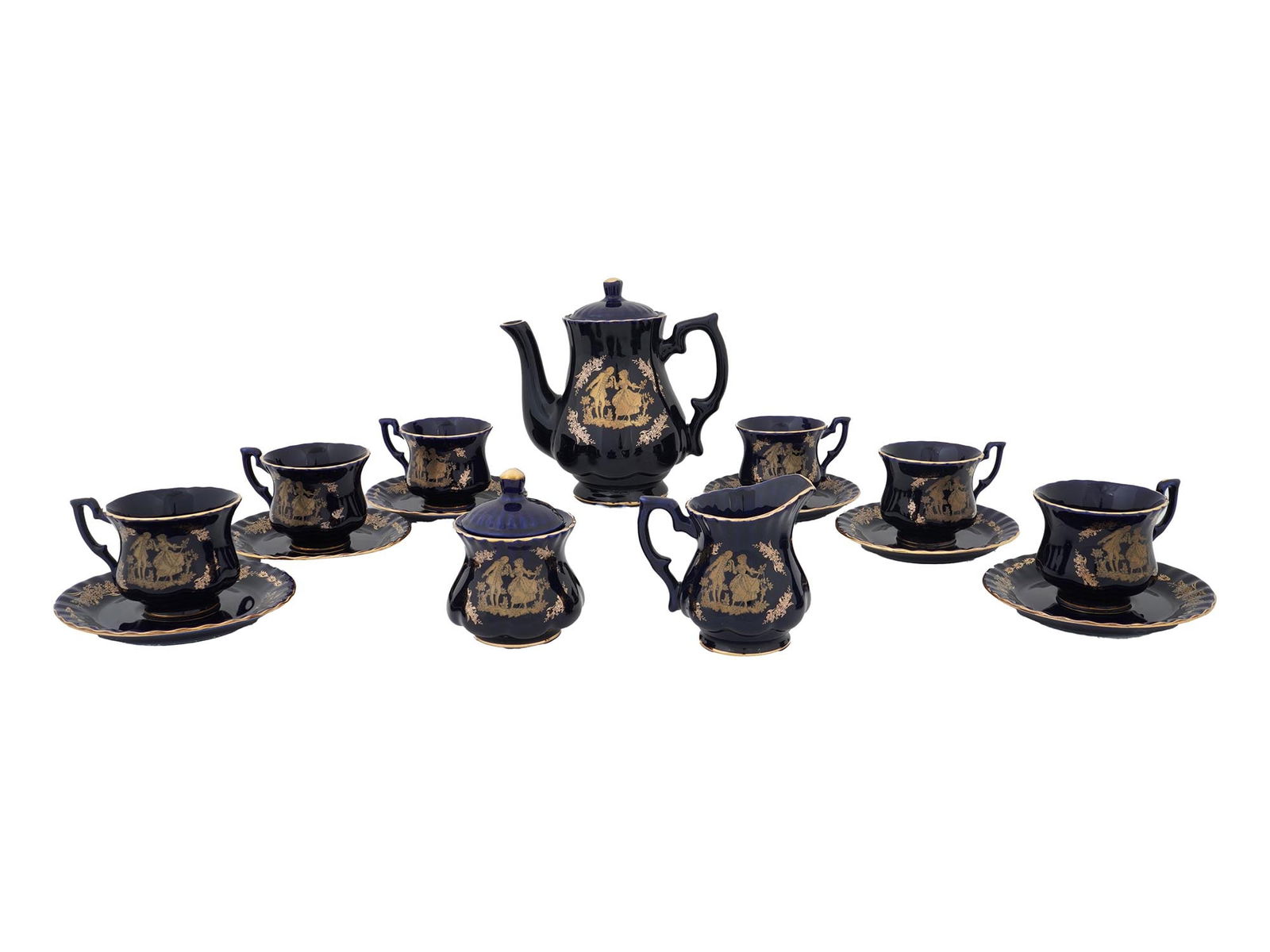 VINTAGE COBALT BLUE AND GILT PORCELAIN TEA SERVICE: A vintage porcelain tea service in Neoclassical Revival style. Each piece is decorated with gilt design featuring a scene with a couple and floral motif on a cobalt blue background. The set includes a