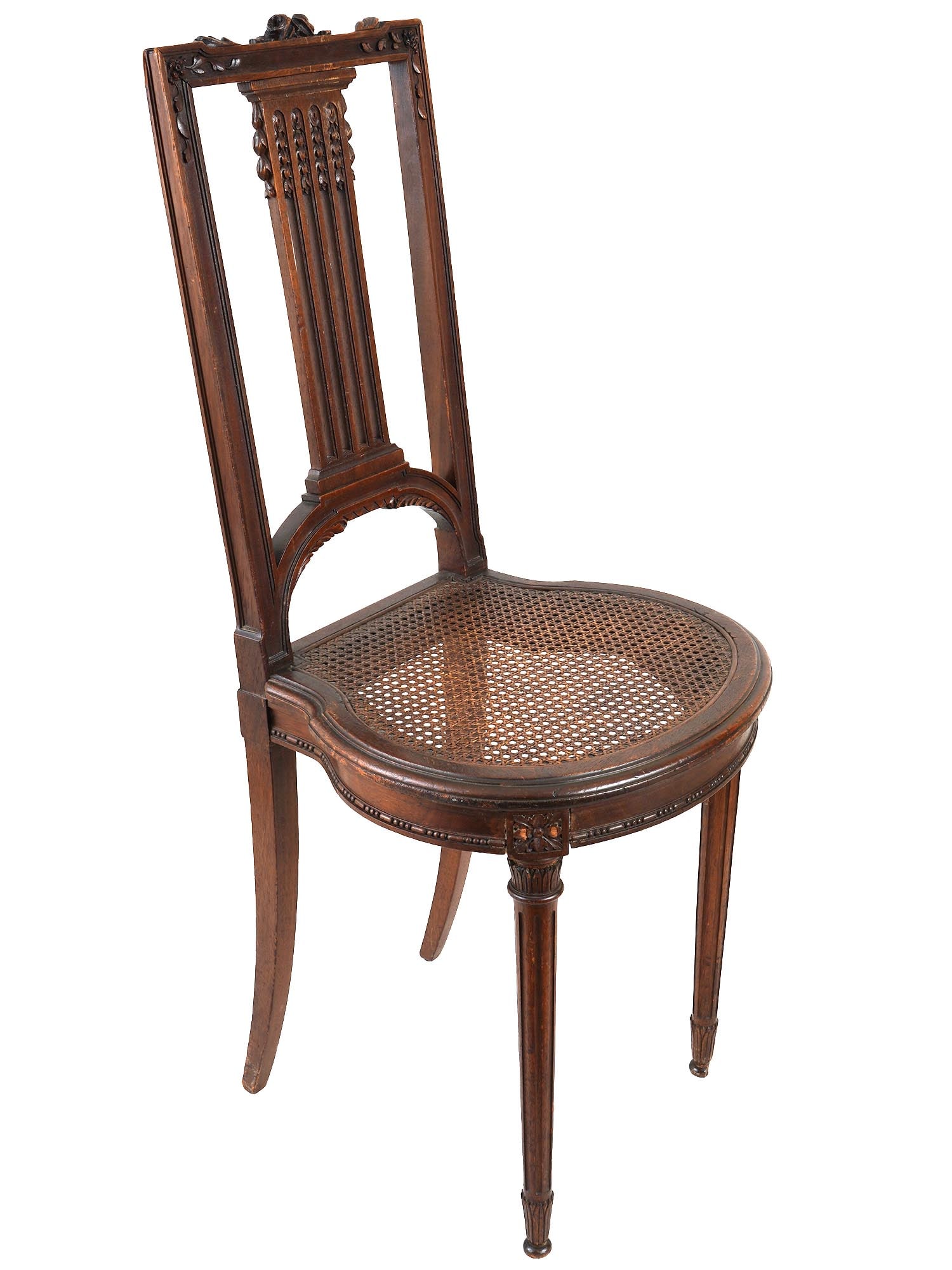 ANTIQUE CARVED WOODEN CHAIR W WOVEN SEAT: An antique carved wooden chair with a tall, rectangular back featuring a series of vertical slats and carved floral details at the top. The seat is made of woven natural materials and has a curved fro