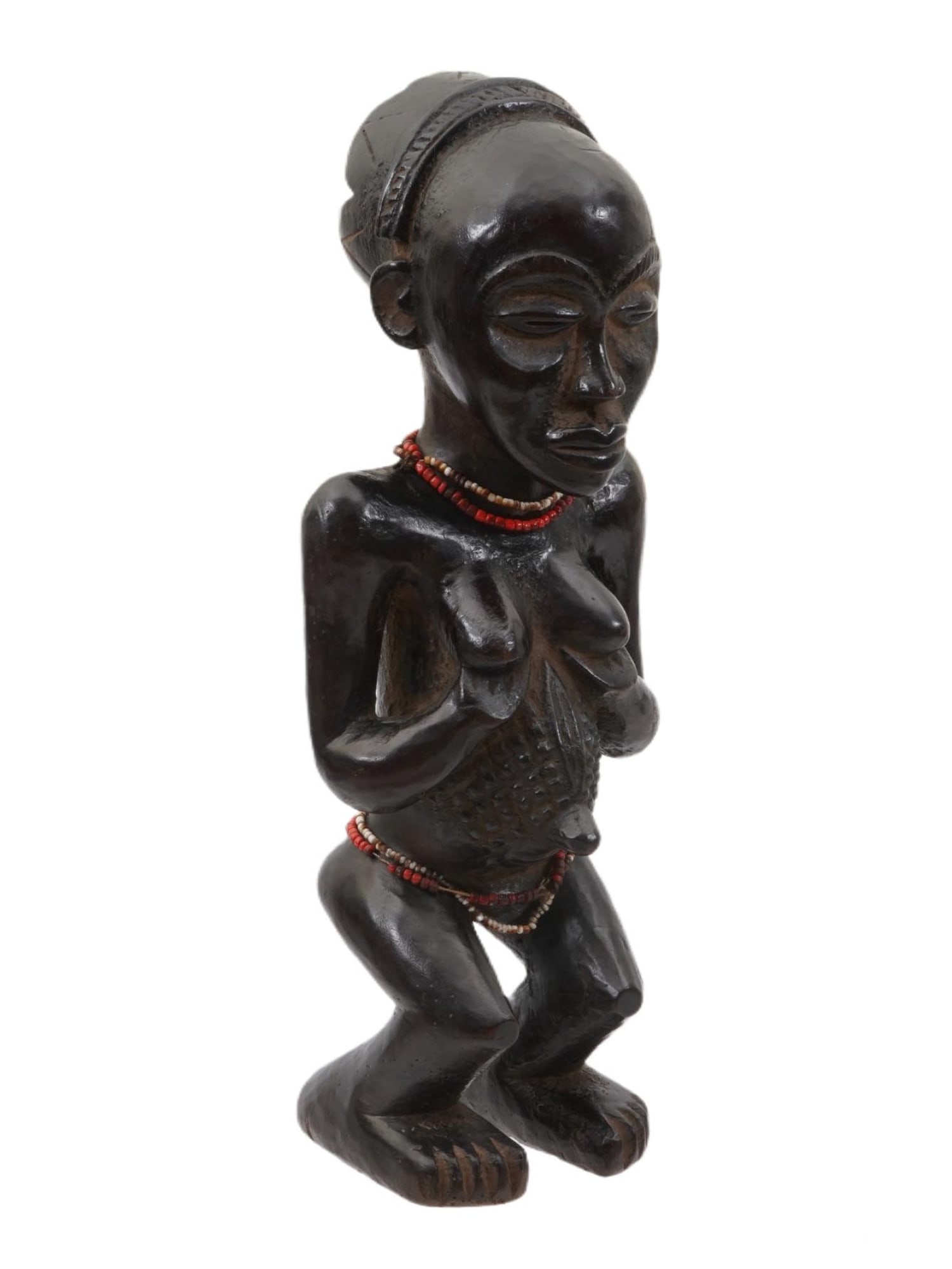 AFRICAN LUBA PEOPLE HAND CARVED WOODEN FEMALE FIGURINE: An African hand carved wooden female figurine of the Luba people of Congo. The stool has a smooth, sloping surface on top, supported by a sculpted female figure. The figure is depicted nude and adorne