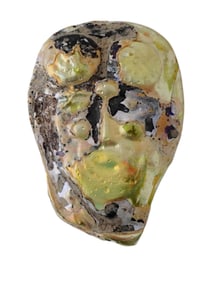 ANCIENT PERSIAN GLASS INLAY FRAGMENT OF A STYLIZED FACE