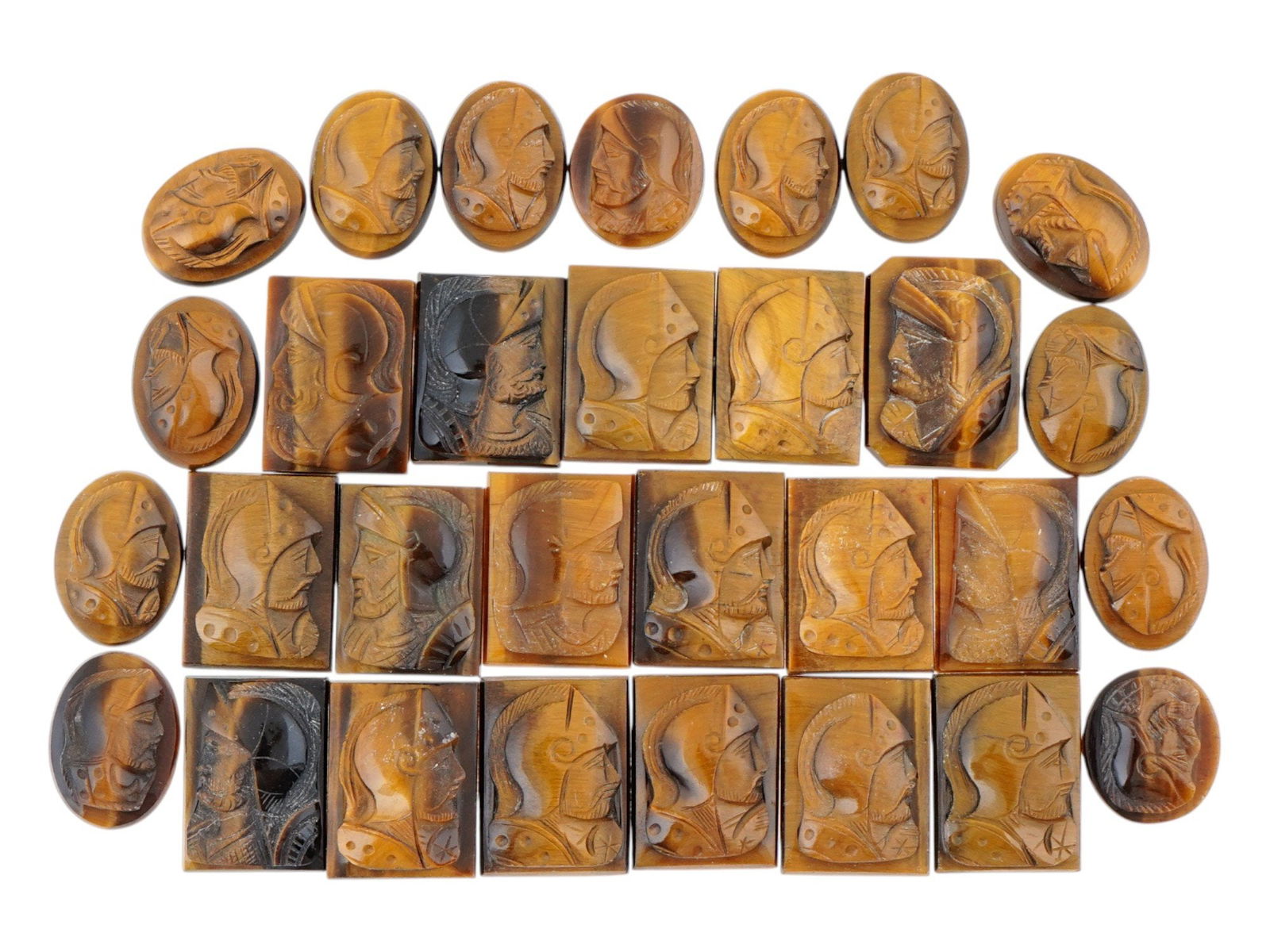 COLLECTION OF HAND CARVED STONE CAMEO MEDALLIONS: A large collection of antique and vintage hand carved cameo medallions. A total of 30 items. Each piece is crafted from stone, featuring warriors portraits in the Roman manner rendered in high relief.