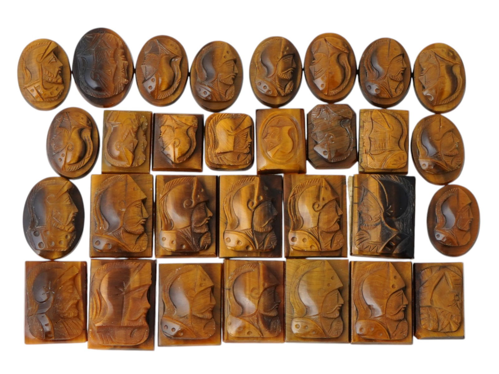 COLLECTION OF ANTIQUE HAND CARVED CAMEOS: A collection of antique hand carved cameos, dating to the late 19th to early 20th century. A total of 30 items. Each piece is crafted from stone, featuring knights in armor rendered in high relief. Th